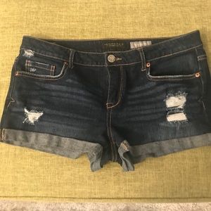 Dark blue denim rider shorts.